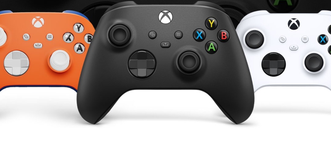 Three Xbox Wireless Controllers in orange, black and white