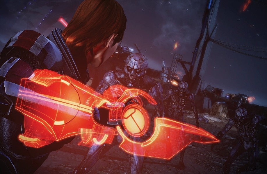 Commander Shepard fighting with a glowing omni-blade in Mass Effect