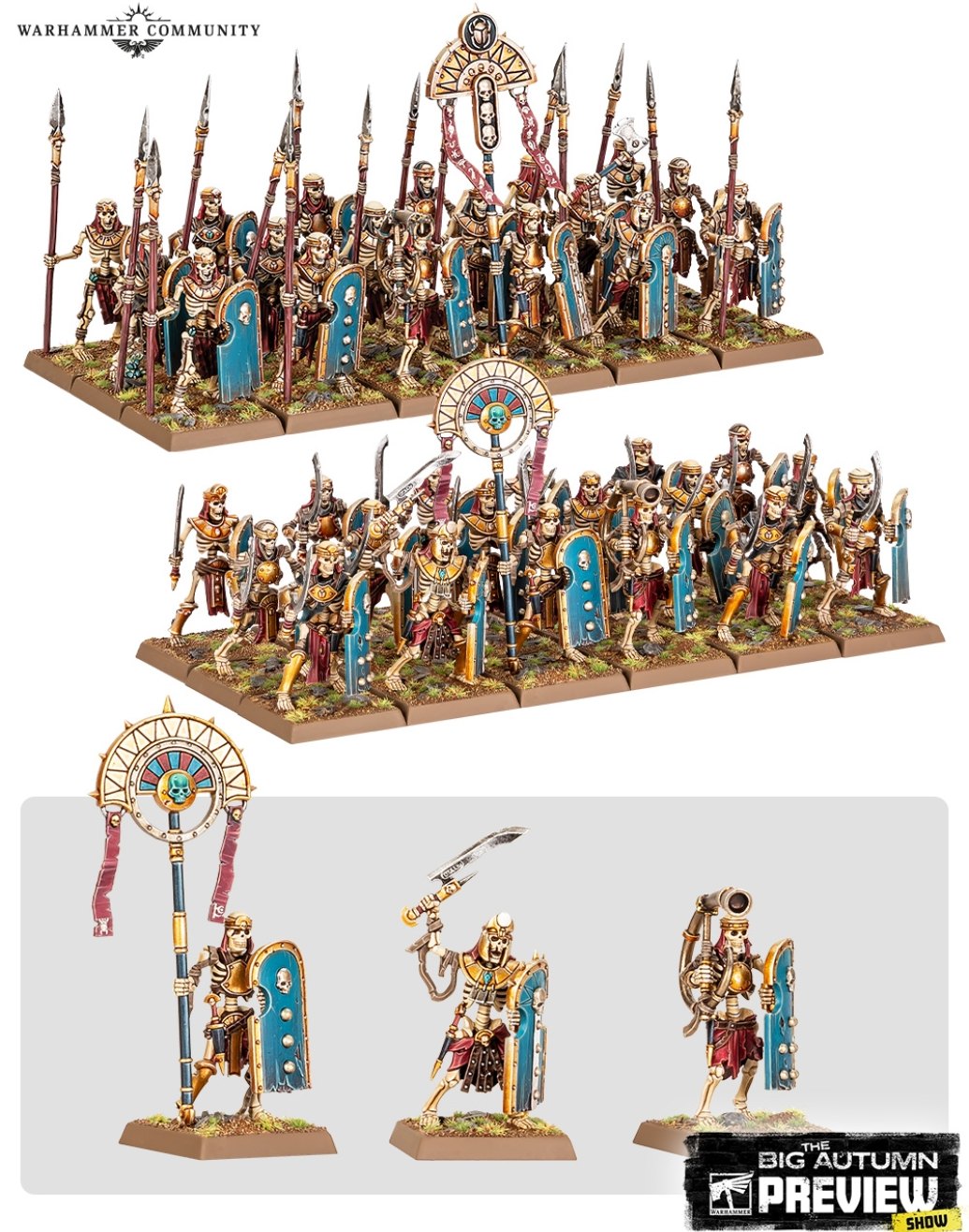 Two painted regiments of Tomb Kings Skeleton Warriors with spears, khopesh swords and blue shields